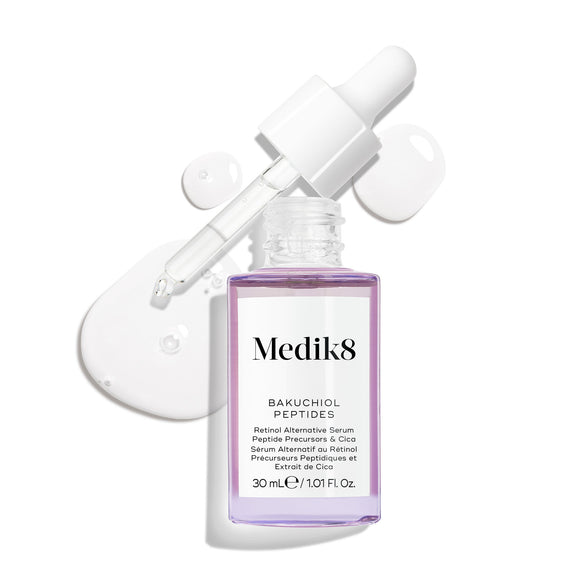 Frasco de vidro roxo com conta-gotas do sérum Bakuchiol Peptides, com a pipeta removida. Uma espiral do sérum roxo é apresentada, destacando a textura do produto.-41